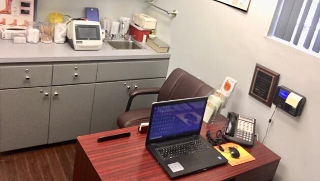Exam room with storage cabinets